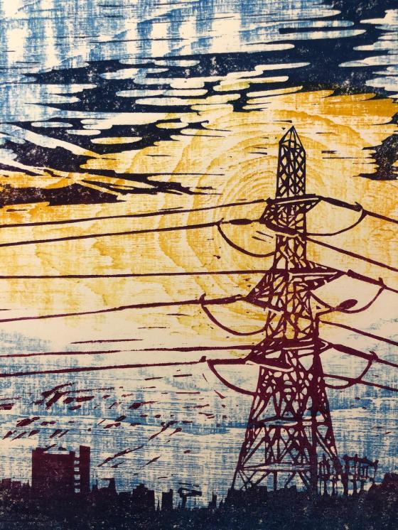 A lino print of an electricity pylon in the foreground, takes up nearly the full height of the page. In the distance is a small tower block that has the main block to one side, and slightly detached but linked by walkways is the lift shaft. In the background, a sunset glows, made by inking up a plank of wood with strong grain, the lines and swirls of the wood grain make the sky, a circular knot forms a sun behind the pylon.